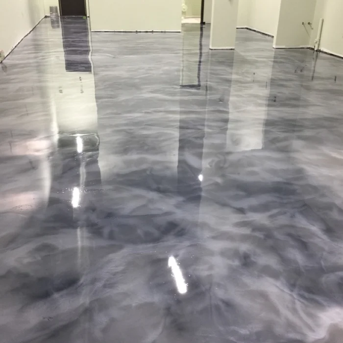 Smoke grey metallic epoxy floor with a high-gloss mirror finish